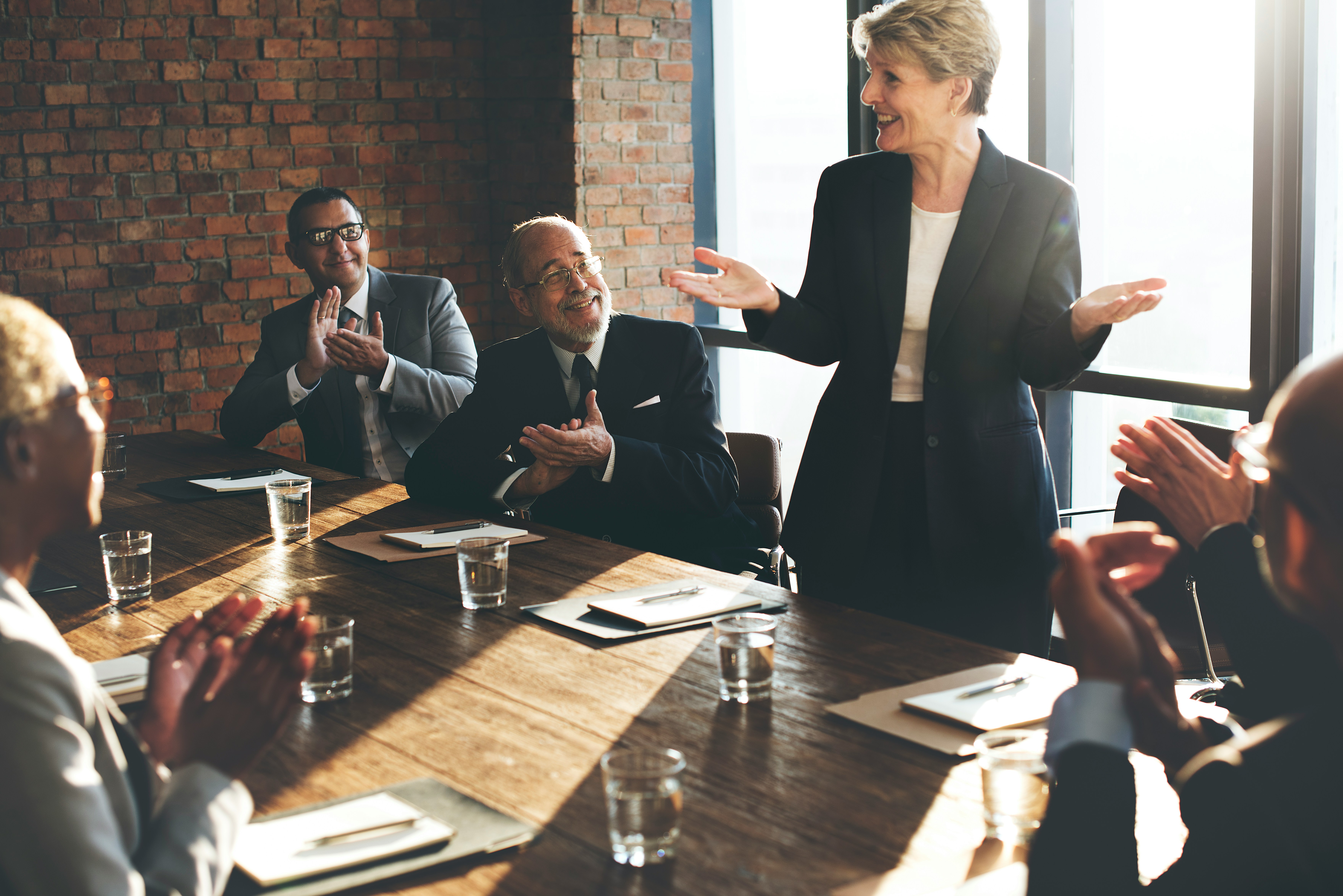 Senior security leader addressing colleagues in a boardroom